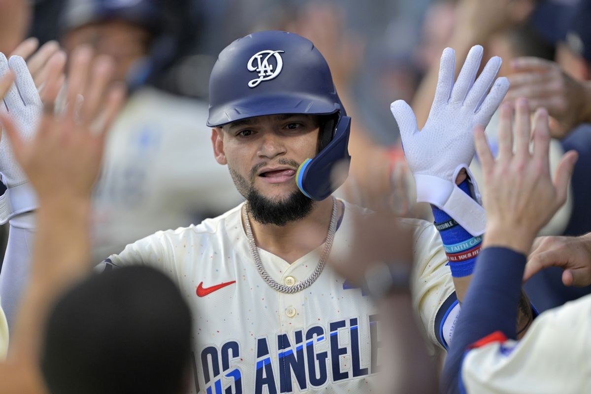 Sep 7, 2024; Los Angeles, California, USA;  Los Angeles Dodgers center fielder Andy Pages (44) is greeted in the dugout after a two run home run in the first inning against the Cleveland Guardians at Dodger Stadium. Mandatory Credit: Jayne Kamin-Oncea-Imagn Images