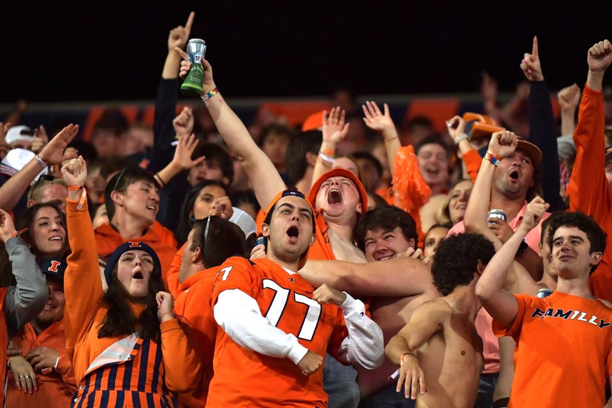Sep 7, 2024; Champaign, Illinois, USA; Fighting Illini fans cheer during the second half against the Kansas Jayhawks at Memorial Stadium. Mandatory Credit: Ron Johnson-Imagn Images