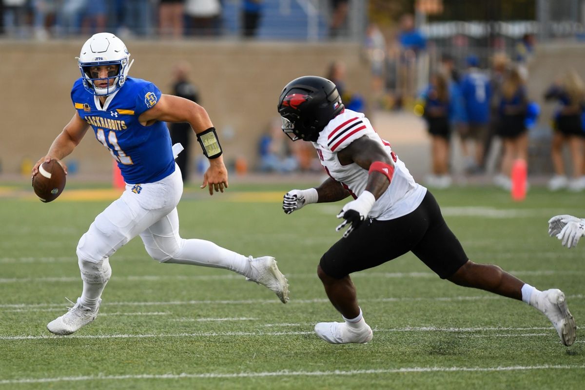 South Dakota State quarterback Mark Gronowski (11) searches for an opening to pass the ball on Saturday, Sept. 7, 2024, at Dana J. Dykhouse Stadium in Brookings.