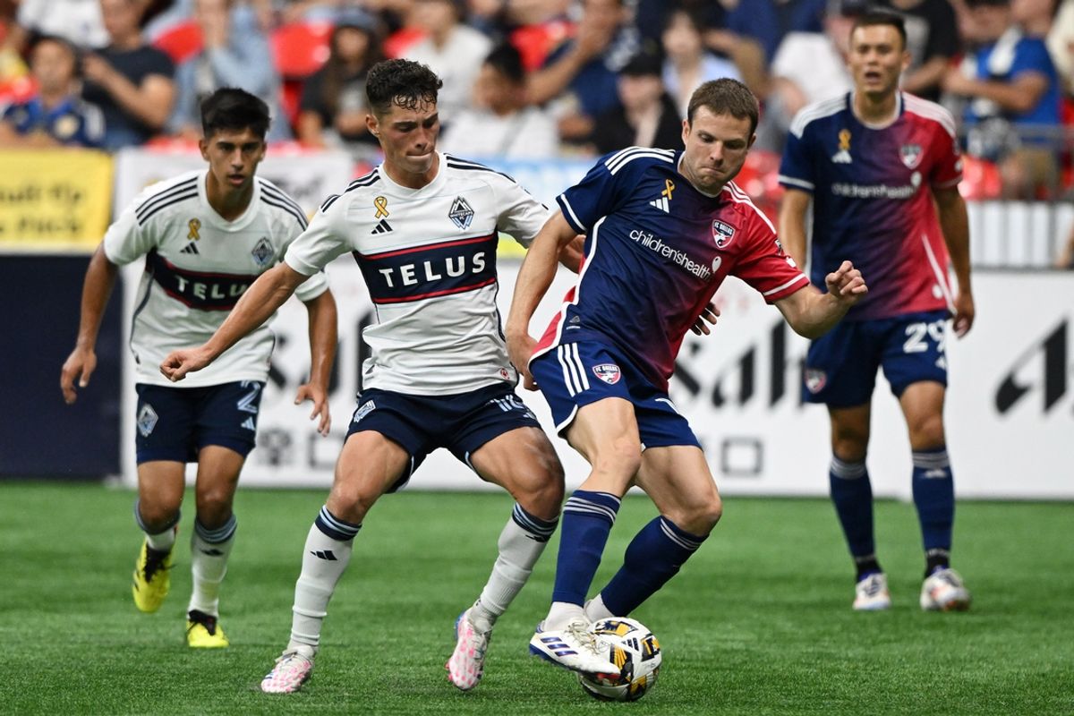 Sep 7, 2024; Vancouver, British Columbia, CAN; FC Dallas midfielder Asier Illarramendi (14) and Vancouver Whitecaps FC midfielder Sebastian Berhalter (16) battle for the ball in the second half at BC Place. Mandatory Credit: Anne-Marie Sorvin-Imagn Images
