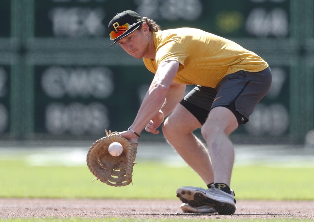 Sep 8, 2024; Pittsburgh, Pennsylvania, USA;  Pittsburgh Pirates infielder Billy Cook (28) takes ground balls at first base before a game against the Washington Nationals at PNC Park. Mandatory Credit: Charles LeClaire-Imagn Images