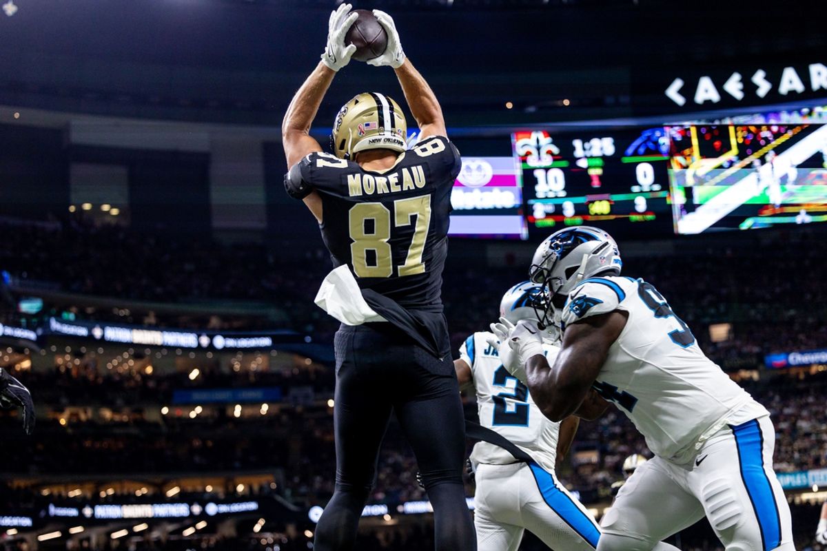 Sep 8, 2024; New Orleans, Louisiana, USA;  New Orleans Saints tight end Foster Moreau (87) scores a touchdown against the Carolina Panthers during the first half at Caesars Superdome. Mandatory Credit: Stephen Lew-Imagn Images