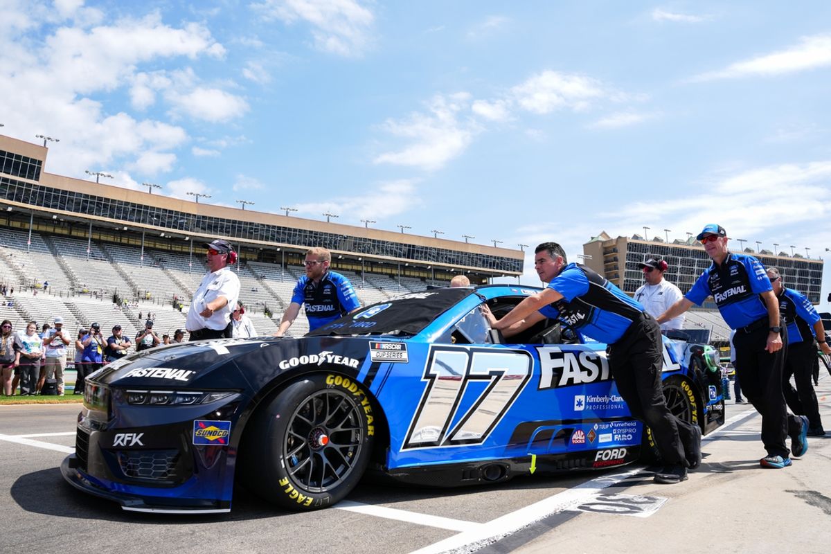 Sep 8, 2024; Hampton, Georgia, USA; The pit crew of NASCAR Cup Series driver Chris Buescher (17) push the car out onto pit road at Atlanta Motor Speedway. Mandatory Credit: Jason Allen-Imagn Images