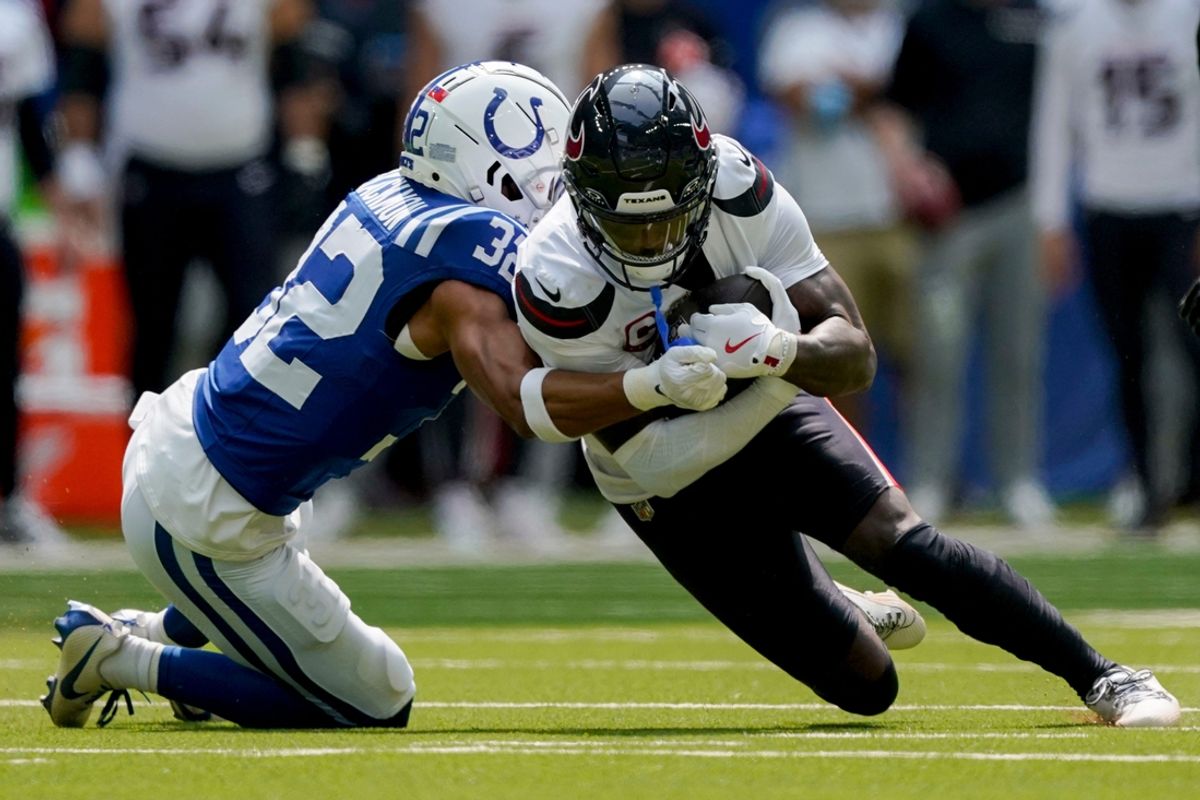 Indianapolis Colts safety Julian Blackmon (32) works to bring down Houston Texans wide receiver Stefon Diggs (1) on Sunday, Sept. 8, 2024, during a game against the Houston Texans at Lucas Oil Stadium in Indianapolis.