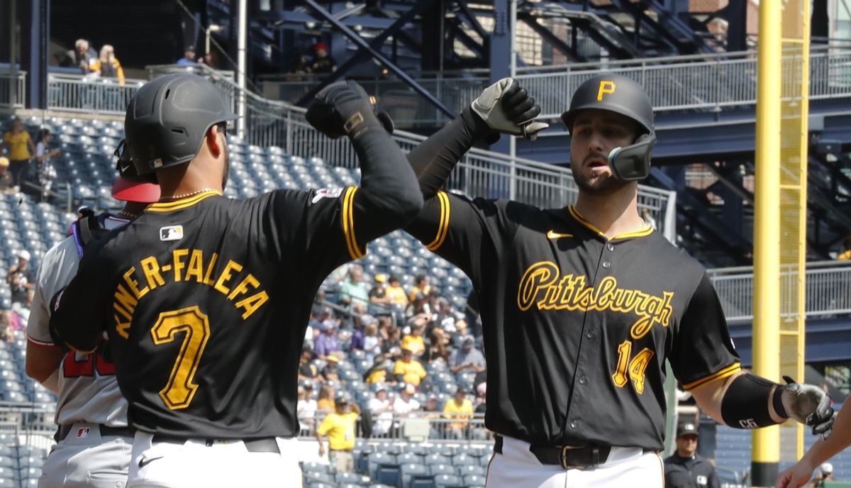 Sep 8, 2024; Pittsburgh, Pennsylvania, USA;  Pittsburgh Pirates third baseman Isiah Kiner-Falefa (7) greets catcher Joey Bart (14) crossing home plate on a two run home run against the Washington Nationals during the first inning at PNC Park. Mandatory Credit: Charles LeClaire-Imagn Images