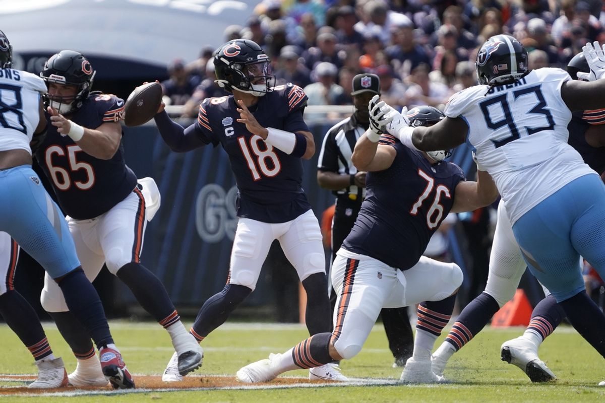 Sep 8, 2024; Chicago, Illinois, USA; Chicago Bears quarterback Caleb Williams (18) passes against the Tennessee Titans during the first half at Soldier Field. Mandatory Credit: David Banks-Imagn Images