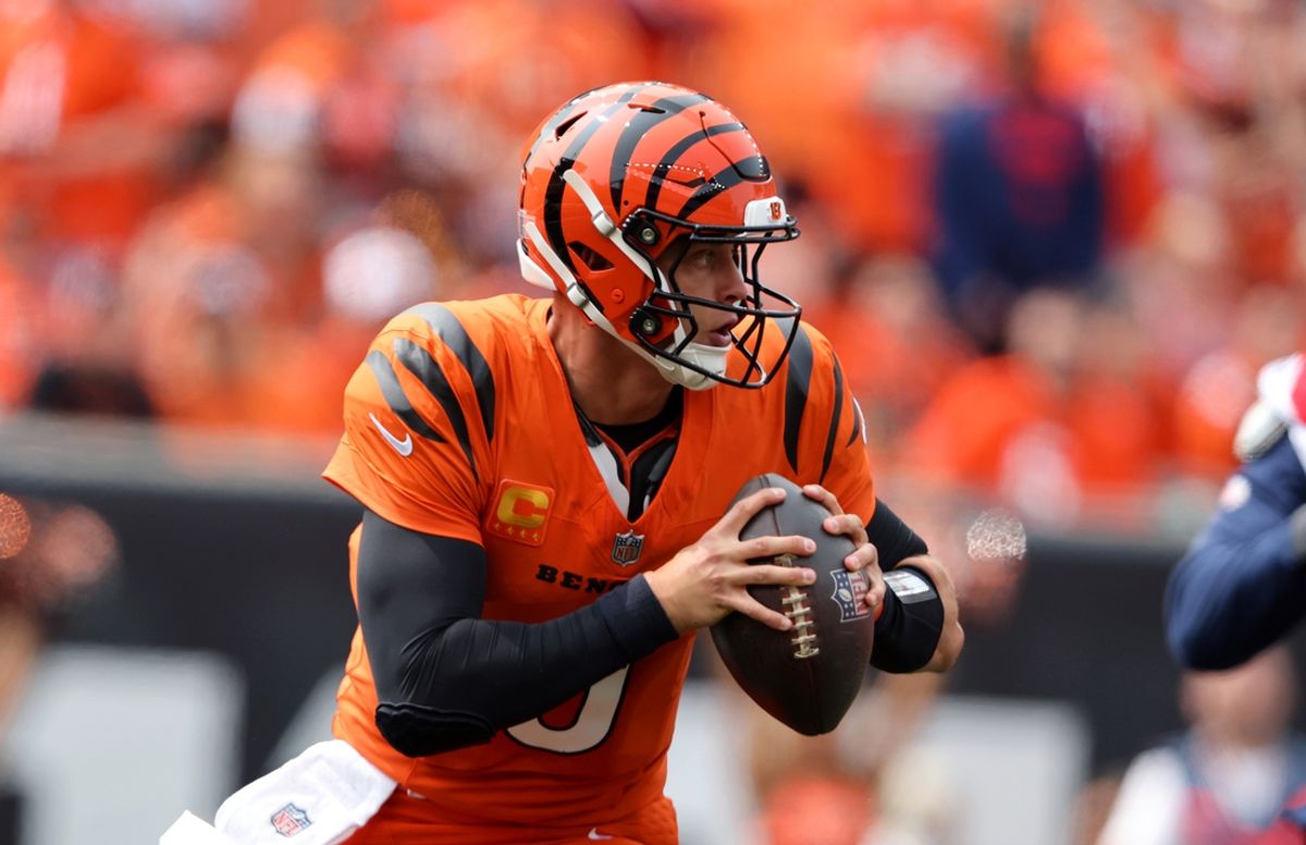 Sep 8, 2024; Cincinnati, Ohio, USA;  Cincinnati Bengals quarterback Joe Burrow (9) runs the ball during the first quarter against the New England Patriots at Paycor Stadium. Mandatory Credit: Joseph Maiorana-Imagn Images