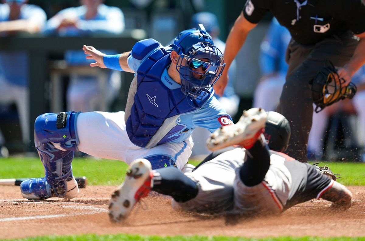 Sep 8, 2024; Kansas City, Missouri, USA; Minnesota Twins first baseman Jose Miranda (64) is tagged out at home by Kansas City Royals catcher Freddy Fermin (34) during the first inning at Kauffman Stadium. Mandatory Credit: Jay Biggerstaff-Imagn Images