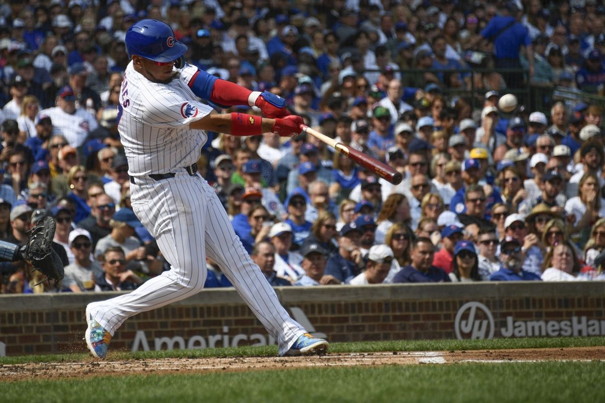 Sep 8, 2024; Chicago, Illinois, USA;  Chicago Cubs third base Isaac Paredes (17) hits an two RBI single against the New York Yankees during the second inning at Wrigley Field. Mandatory Credit: Matt Marton-Imagn Images