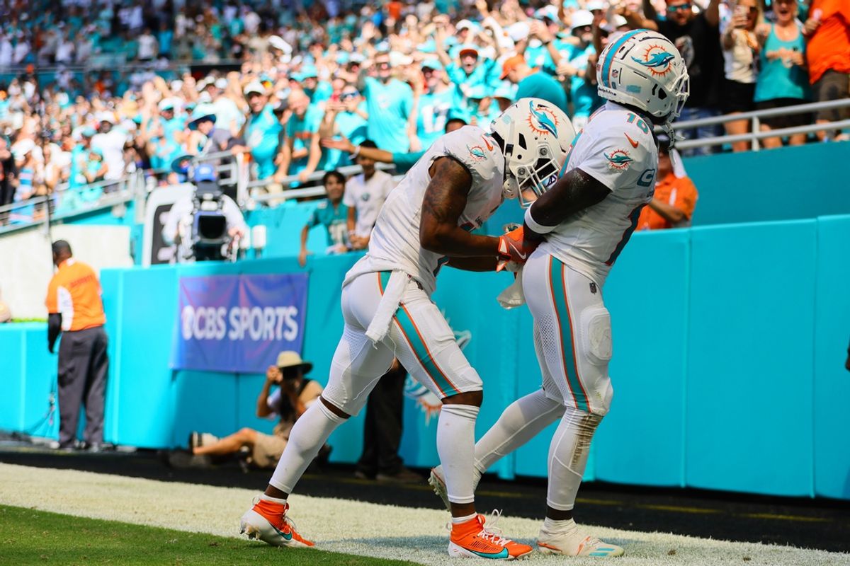 Sep 8, 2024; Miami Gardens, Florida, USA; Miami Dolphins wide receiver Tyreek Hill (10) celebrates with wide receiver Jaylen Waddle (17) after scoring a touchdown against the Jacksonville Jaguars during the third quarter at Hard Rock Stadium. Mandatory Credit: Sam Navarro-Imagn Images