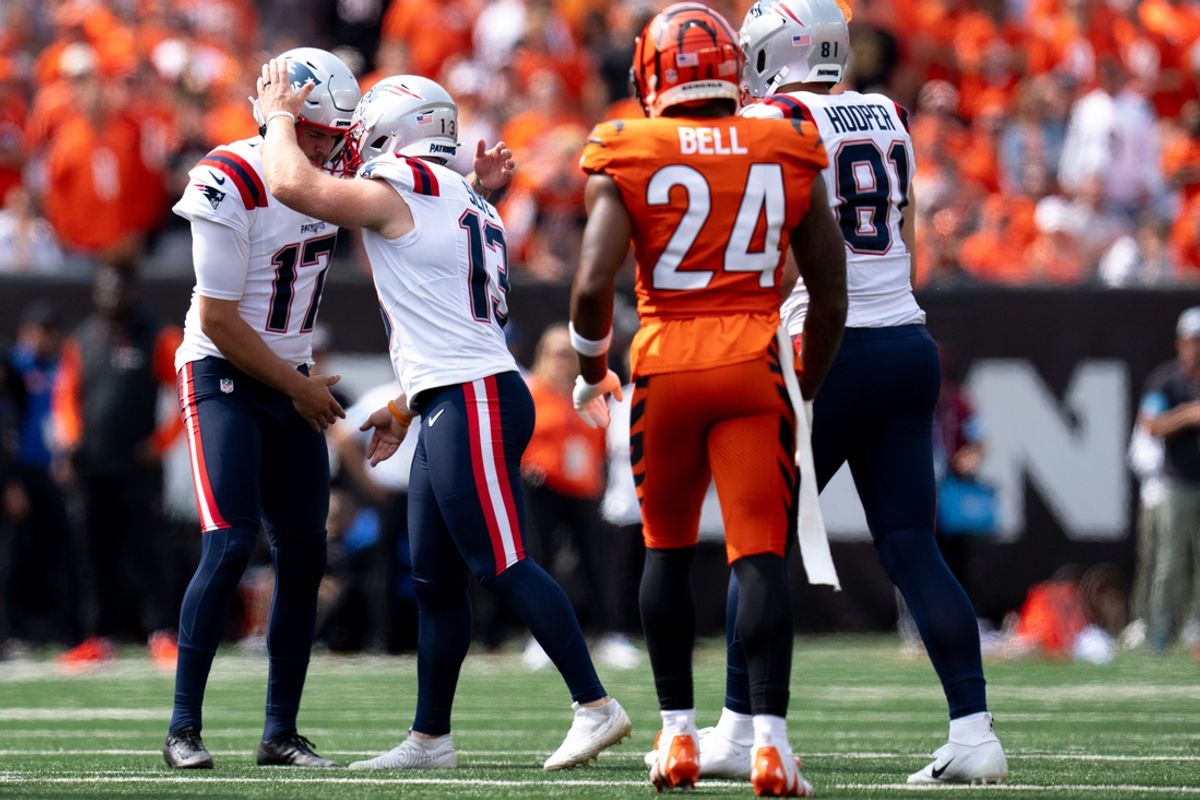 New England Patriots kicker Joey Slye (13) reacts with New England Patriots punter Bryce Baringer (17) in the third quarter of the NFL game at Paycor Stadium in Cincinnati on Sunday, Sept. 8, 2024.
