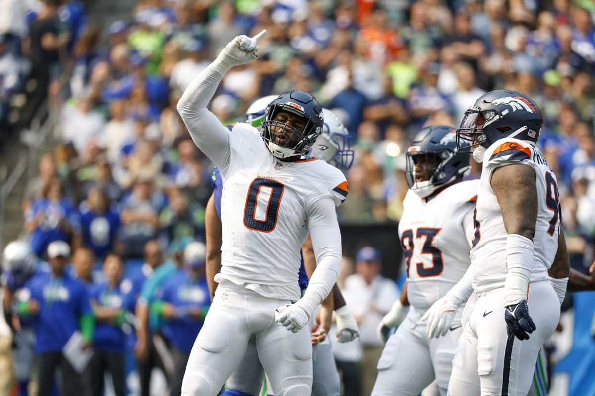 Sep 8, 2024; Seattle, Washington, USA; Denver Broncos linebacker Jonathon Cooper (0) celebrates following a sack against the Seattle Seahawks during the first quarter at Lumen Field. Mandatory Credit: Joe Nicholson-Imagn Images