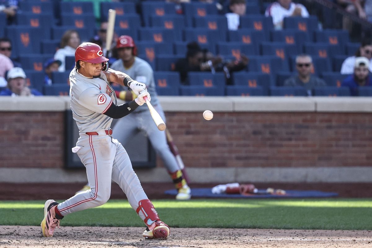 Sep 8, 2024; New York City, New York, USA;  Cincinnati Reds designated hitter Santiago Espinal (4) his a two run double in the ninth inning against the New York Mets at Citi Field. Mandatory Credit: Wendell Cruz-Imagn Images
