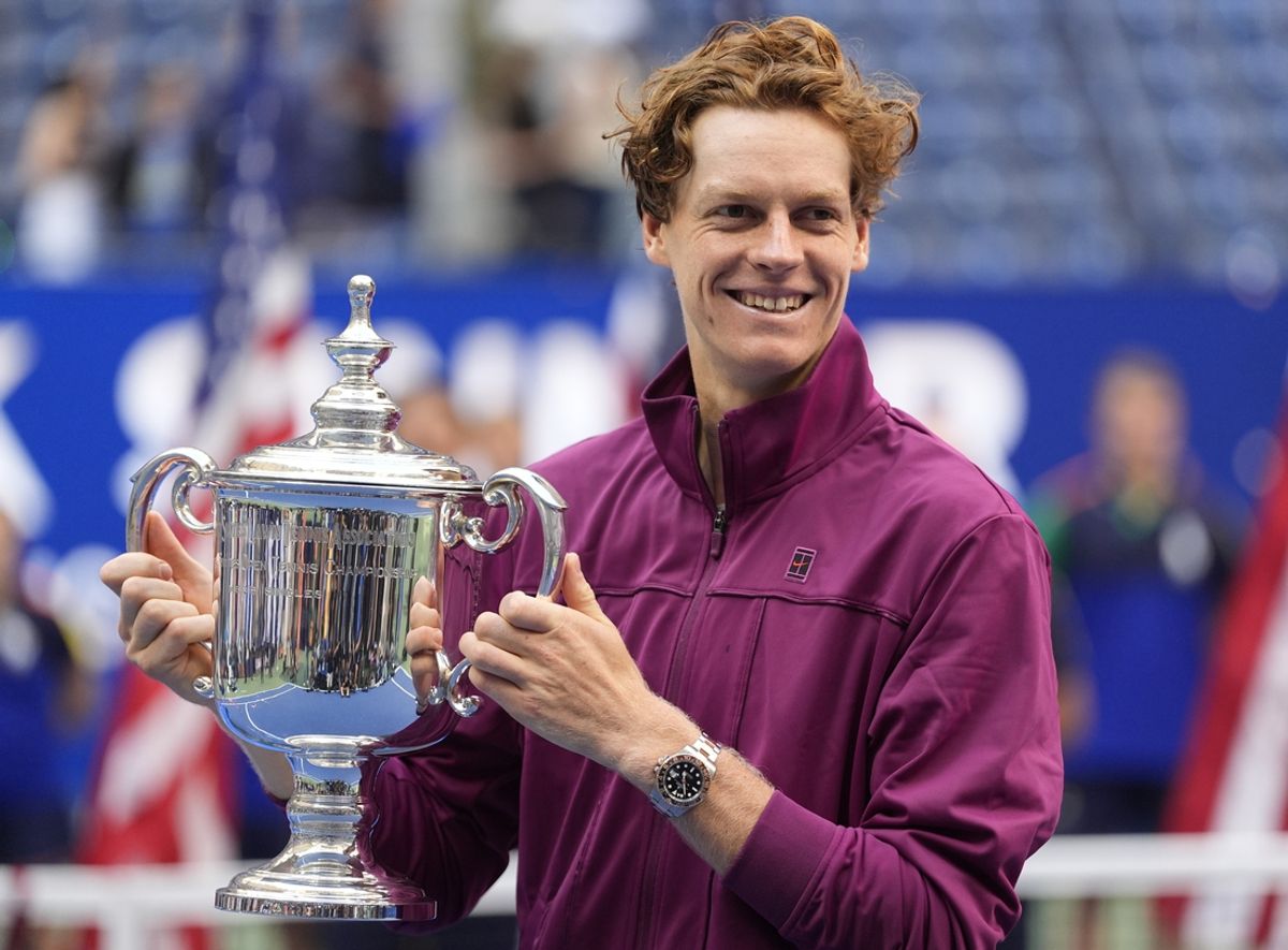 Sep 8, 2024; Flushing, NY, USA; Jannik Sinner (ITA) celebrates with the trophy after defeating Taylor Fritz (USA) in the men’s singles final of the 2024 U.S. Open tennis tournament at USTA Billie Jean King National Tennis Center. Mandatory Credit: Robert Deutsch-Imagn Images