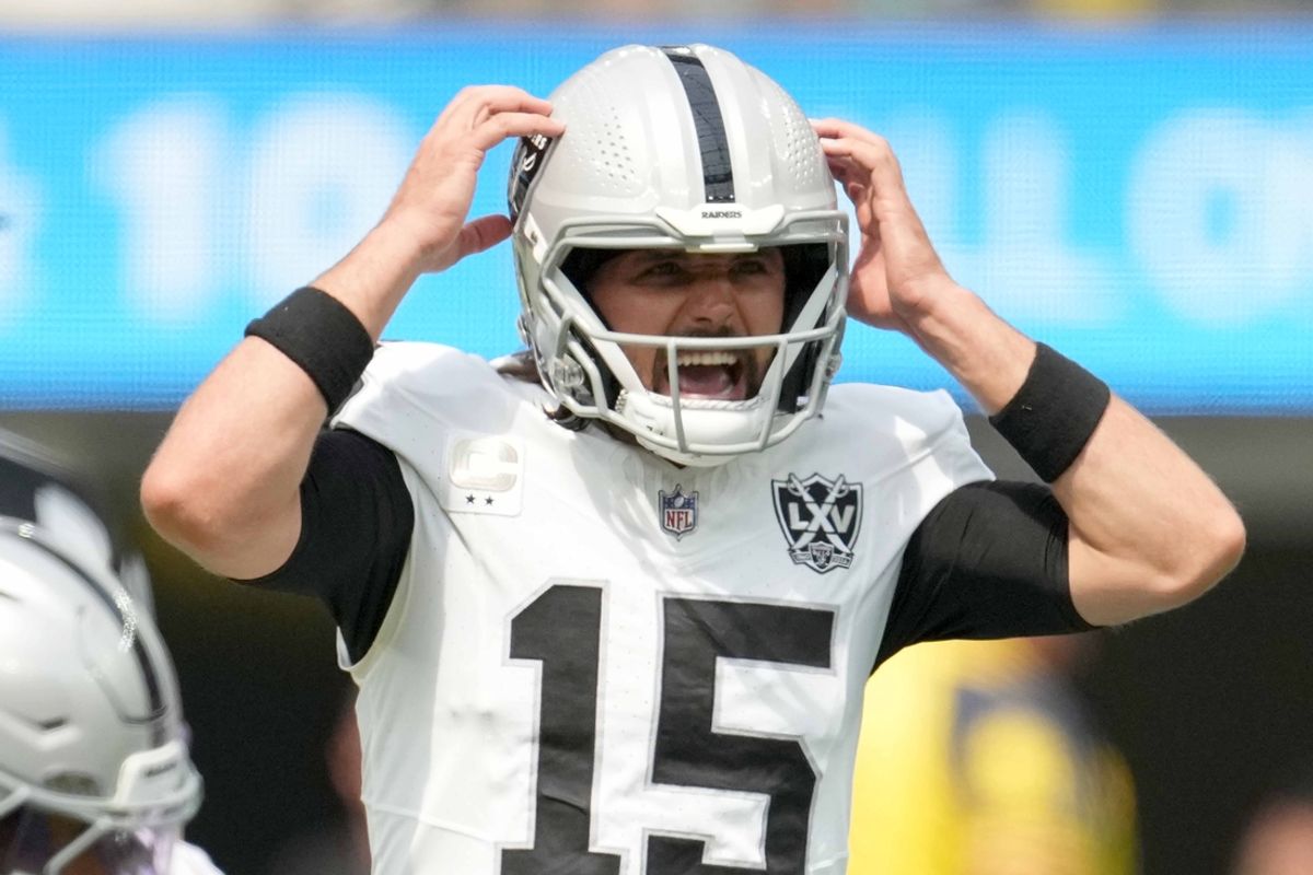 Sep 8, 2024; Inglewood, California, USA; Las Vegas Raiders quarterback Gardner Minshew (15) prepares to take the snap against the Los Angeles Chargers in the first half at SoFi Stadium. Mandatory Credit: Kirby Lee-Imagn Images