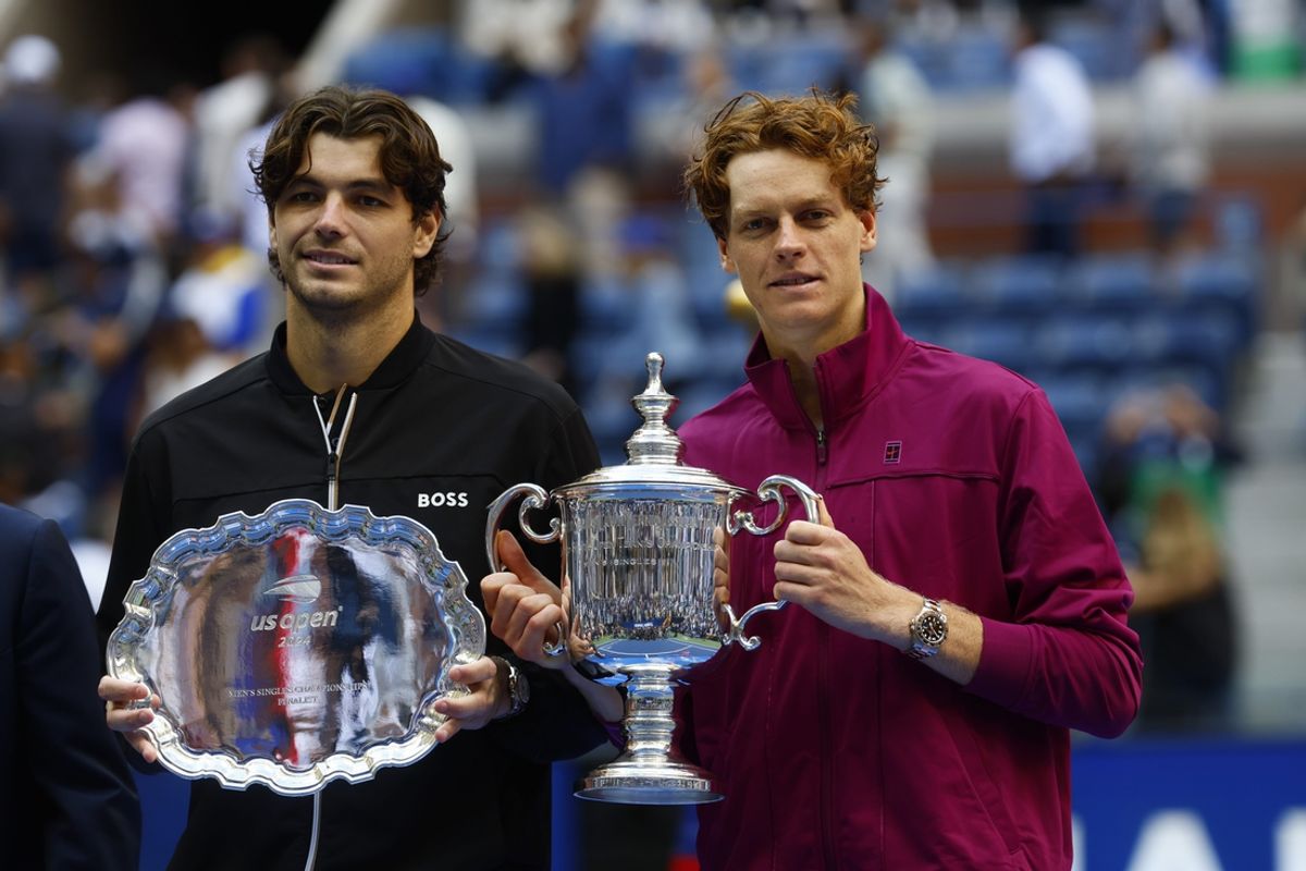 Sep 8, 2024; Flushing, NY, USA; Jannik Sinner (ITA) and Taylor Fritz (USA) pose for a photo with their trophies after the men’s singles final of the 2024 U.S. Open tennis tournament at USTA Billie Jean King National Tennis Center. Mandatory Credit: Mike Frey-Imagn Images
