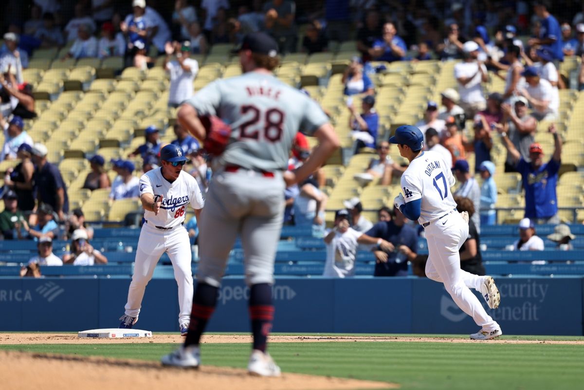 Sep 8, 2024; Los Angeles, California, USA;  Los Angeles Dodgers designated hitter Shohei Ohtani (17) hits a home run off Cleveland Guardians starting pitcher Tanner Bibee (28) during the fifth inning of a MLB baseball game at Dodger Stadium. Mandatory Credit: Kiyoshi Mio-Imagn Images