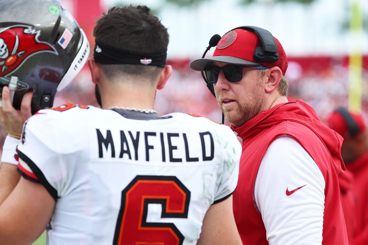 Sep 8, 2024; Tampa, Florida, USA;  Tampa Bay Buccaneers quarterback Baker Mayfield (6) talks with offensive coordinator Liam Coen against the Washington Commanders during the first half at Raymond James Stadium. Mandatory Credit: Kim Klement Neitzel-Imagn Images