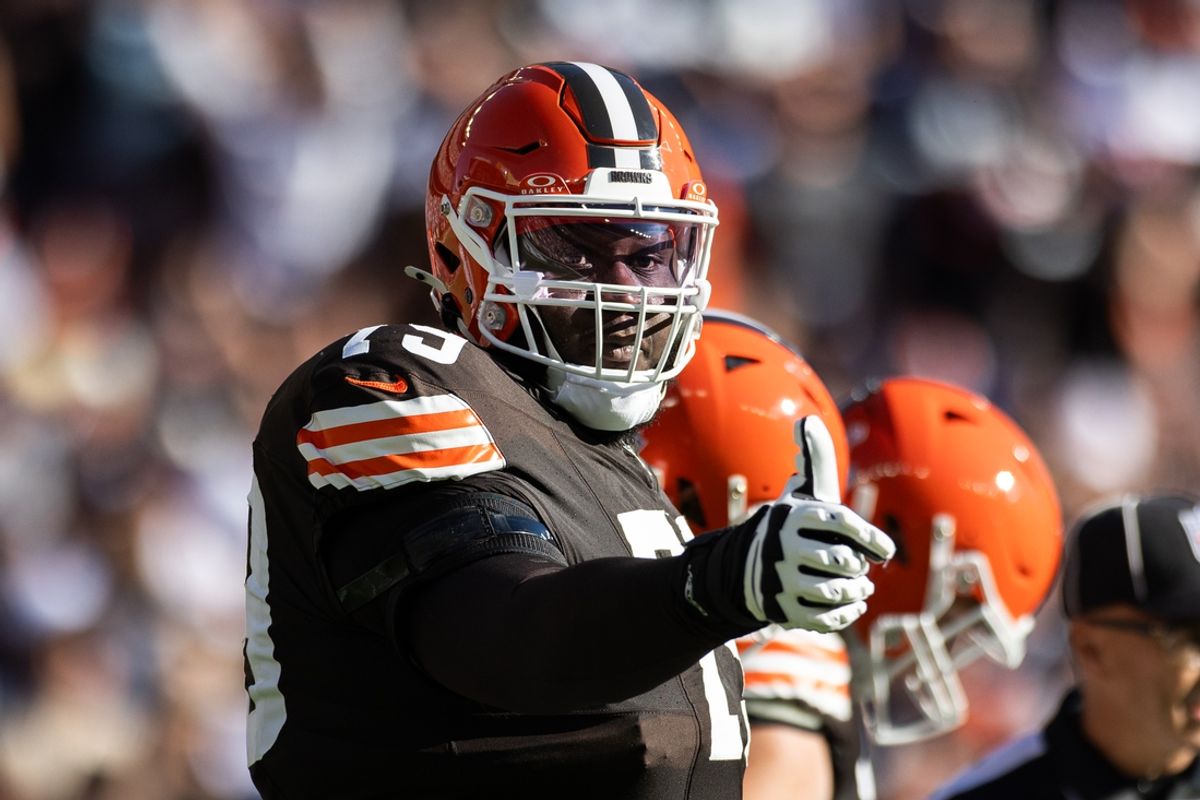 Sep 8, 2024; Cleveland, Ohio, USA; Cleveland Browns offensive tackle Dawand Jones (79) gives a thumbs up as he heads to the line of scrimmage against the Dallas Cowboys during the second quarter at Huntington Bank Field. Mandatory Credit: Scott Galvin-Imagn Images