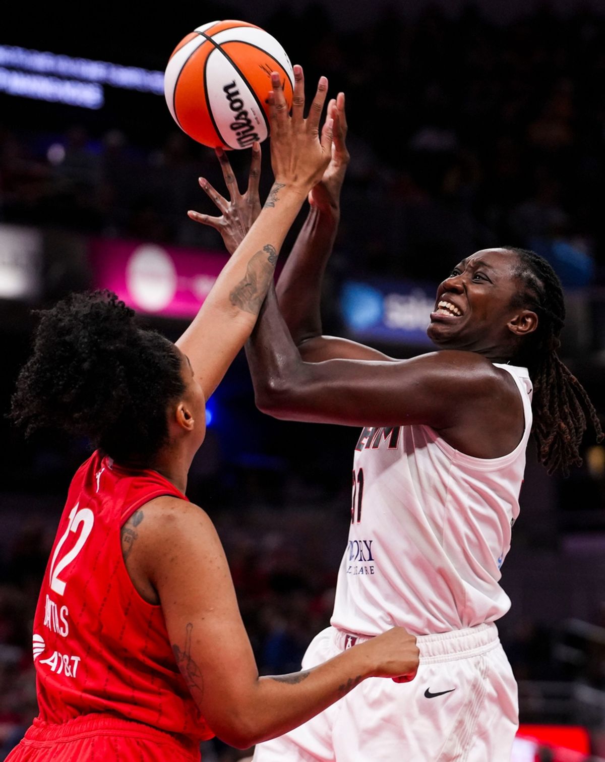 Atlanta Dream center Tina Charles (31) goes up for a shot against Indiana Fever forward Damiris Dantas (12) on Sunday, Sept. 8, 2024, during a game between the Indiana Fever and the Atlanta Dream at Gainbridge Fieldhouse in Indianapolis. The Fever defeated the Dream in overtime, 104-100.