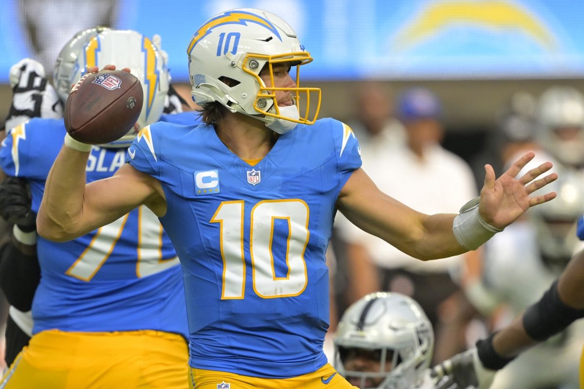 Sep 8, 2024; Inglewood, California, USA; Los Angeles Chargers quarterback Justin Herbert (10) looks to pass in the second half against the Las Vegas Raiders at SoFi Stadium. Mandatory Credit: Jayne Kamin-Oncea-Imagn Images