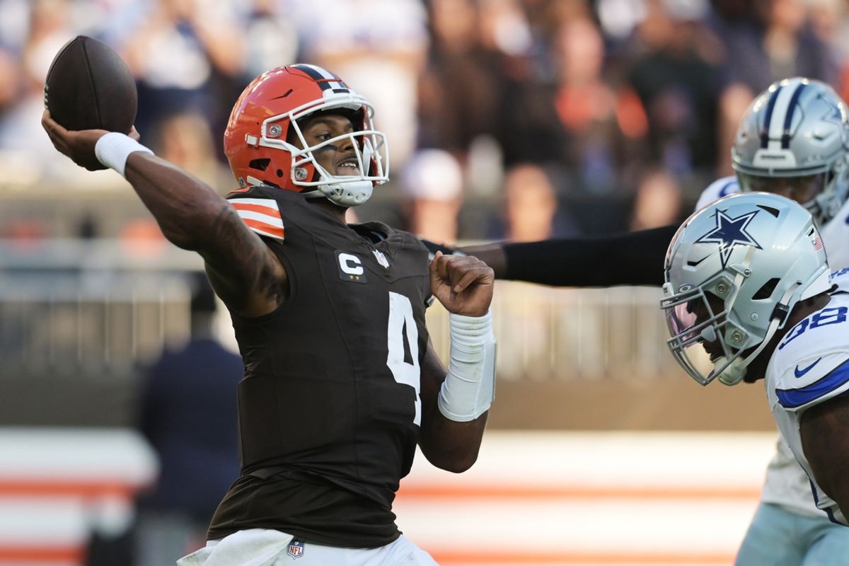 Sep 8, 2024; Cleveland, Ohio, USA; Cleveland Browns quarterback Deshaun Watson (4) throws a pass under pressure for the Dallas Cowboys line during the second half at Huntington Bank Field. Mandatory Credit: Ken Blaze-Imagn Images