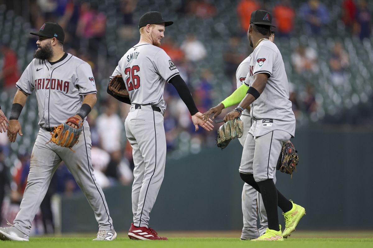 Sep 8, 2024; Houston, Texas, USA; Arizona Diamondbacks left fielder Pavin Smith (26) celebrates with teammates after the game against the Houston Astros at Minute Maid Park. Mandatory Credit: Troy Taormina-Imagn Images