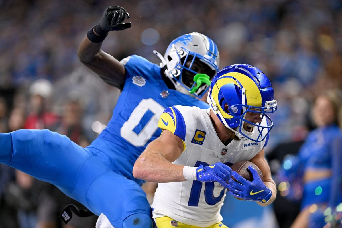 Sep 8, 2024; Detroit, Michigan, USA; Los Angeles Rams wide receiver Cooper Kupp (10) runs past Detroit Lions cornerback Terrion Arnold (0) to score a touchdown in the fourth quarter at Ford Field. Mandatory Credit: Lon Horwedel-Imagn Images