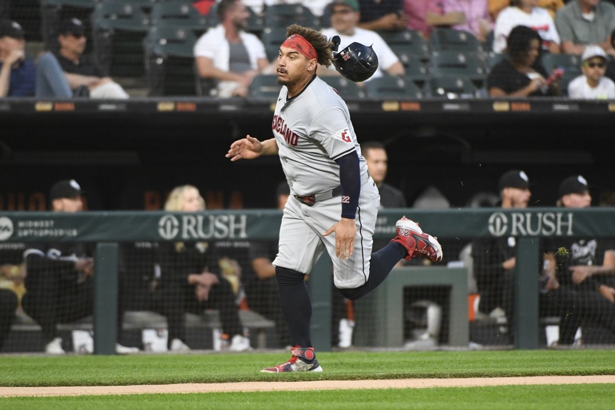 Sep 9, 2024; Chicago, Illinois, USA;  Cleveland Guardians first baseman Josh Naylor (22) loses his helmet before scoring against the Chicago White Sox during the first inning at Guaranteed Rate Field. Mandatory Credit: Matt Marton-Imagn Images