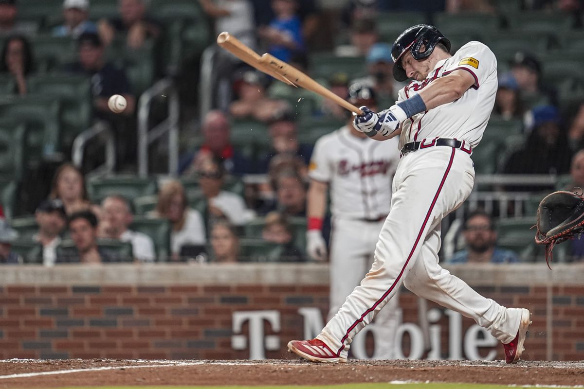 Sep 9, 2024; Cumberland, Georgia, USA; Atlanta Braves catcher Sean Murphy (12) splinters his bat while lining out against the Cincinnati Reds during the seventh inning at Truist Park. Mandatory Credit: Dale Zanine-Imagn Images