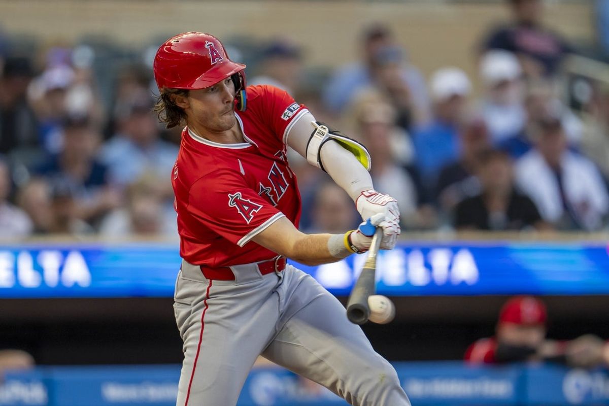 Sep 9, 2024; Minneapolis, Minnesota, USA; Los Angeles Angels center fielder Bryce Teodosio (22) hits a ground ball against the Minnesota Twins in the second inning at Target Field. Mandatory Credit: Jesse Johnson-Imagn Images