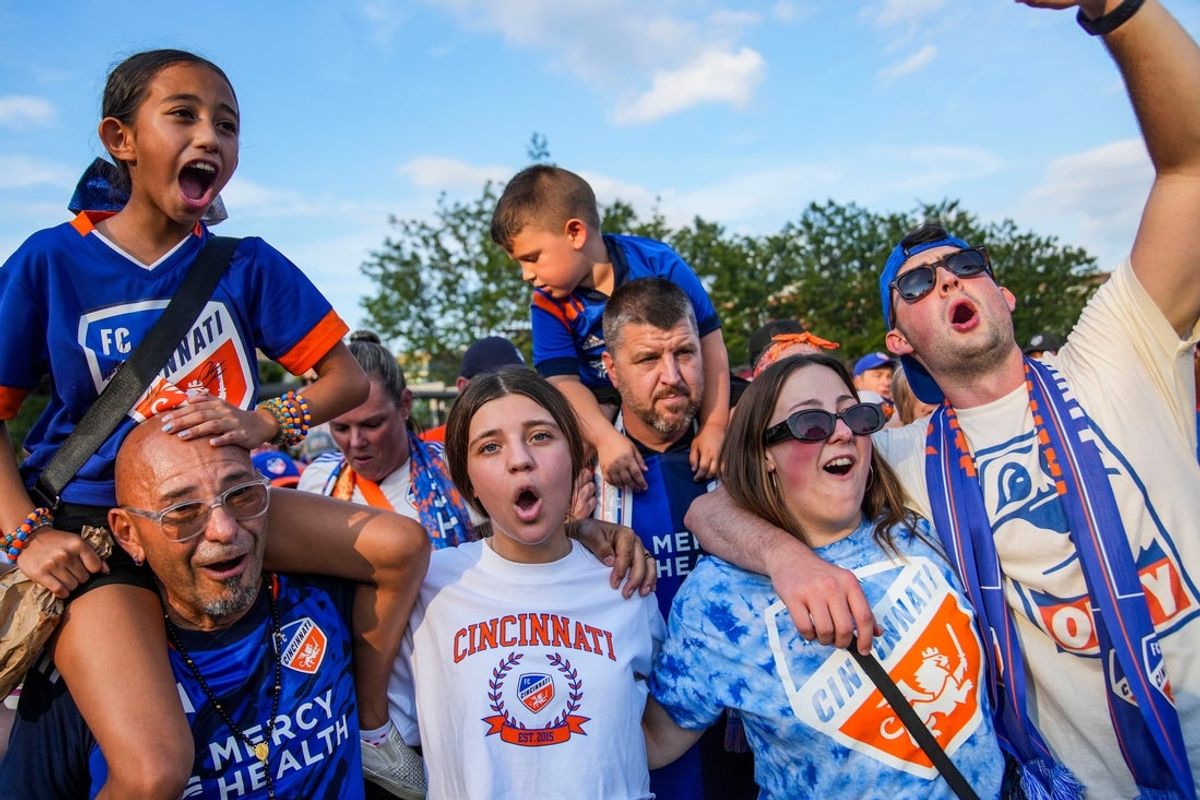 A group sings Saturday, Aug. 31, 2024, as FC Cincinnati supporters participate in March to the Match, a celebratory march before first kick from bars and breweries to TQL Stadium in Cincinnati, Ohio.
