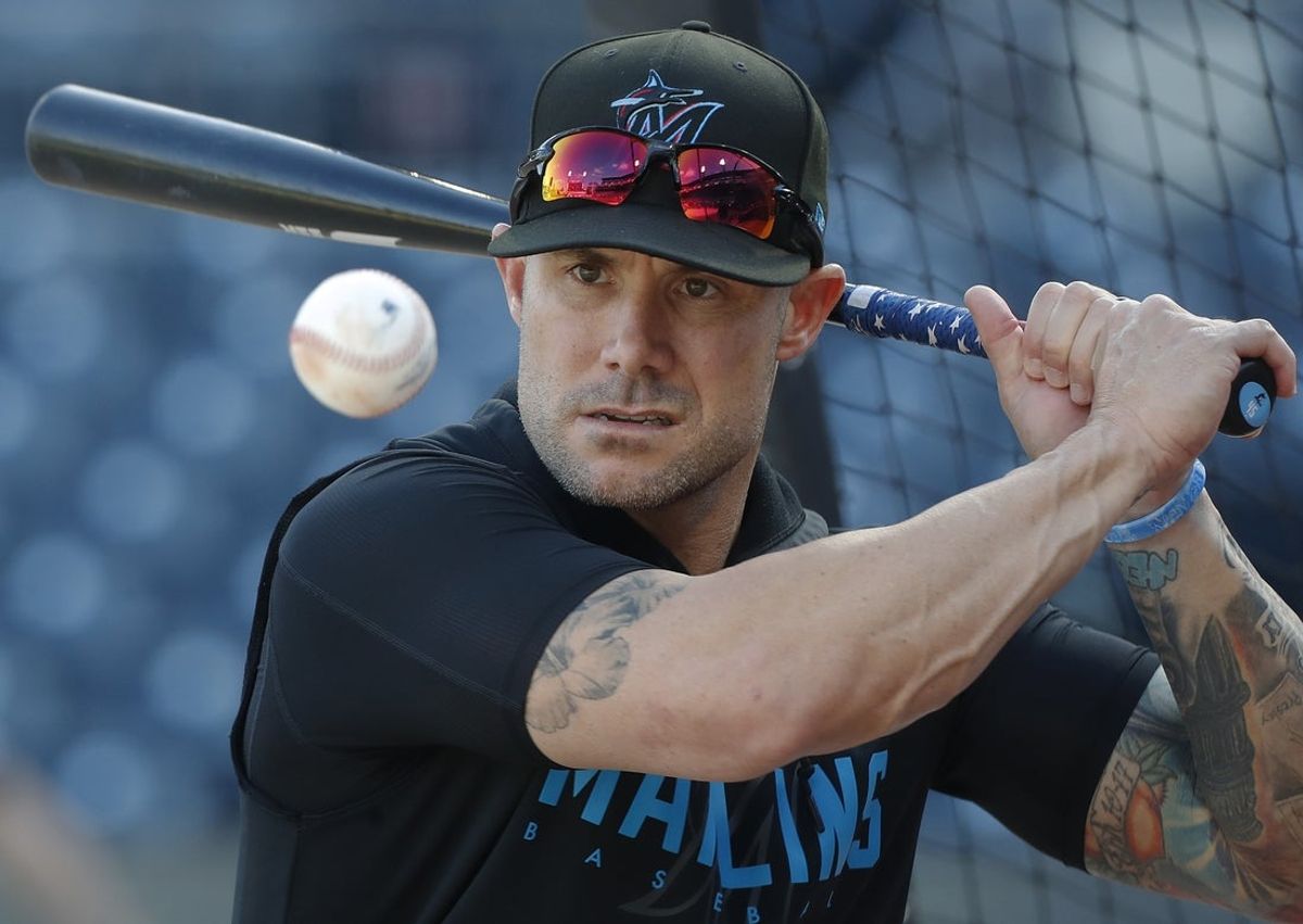 Sep 10, 2024; Pittsburgh, Pennsylvania, USA;  Miami Marlins manager Skip Schumaker (45) hits ground balls during batting practice before a game against the Pittsburgh Pirates at PNC Park. Mandatory Credit: Charles LeClaire-Imagn Images