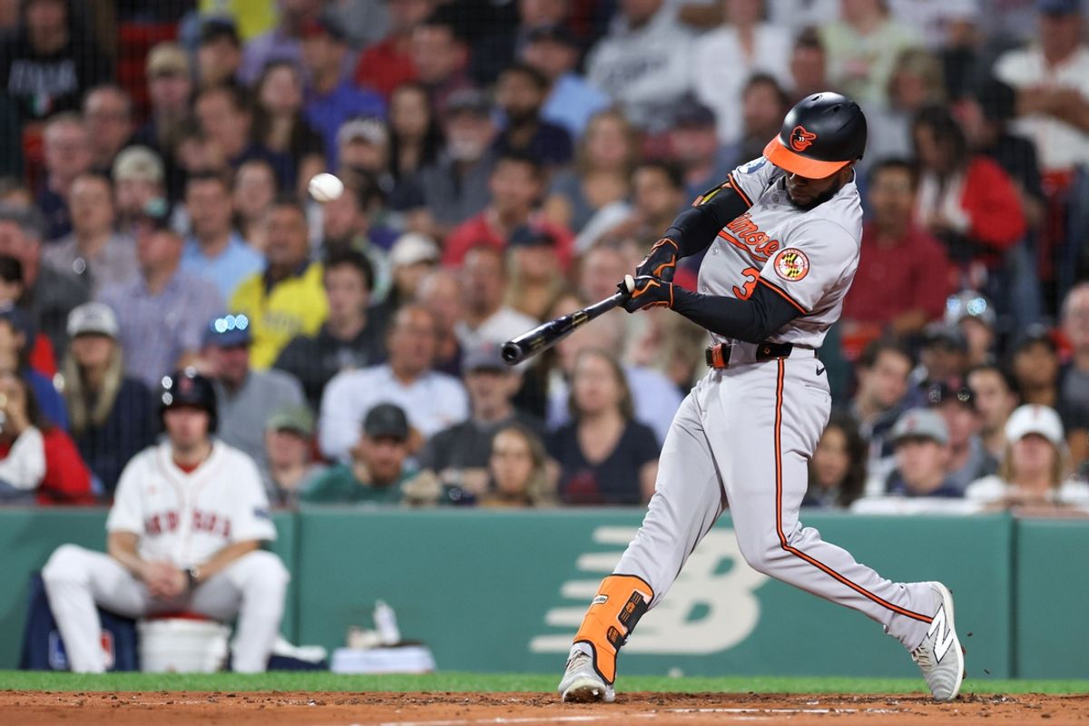 Sep 10, 2024; Boston, Massachusetts, USA; Baltimore Orioles center fielder Cedric Mullins (31) hits a two run home run during the third inning against the Boston Red Sox at Fenway Park. Mandatory Credit: Paul Rutherford-Imagn Images