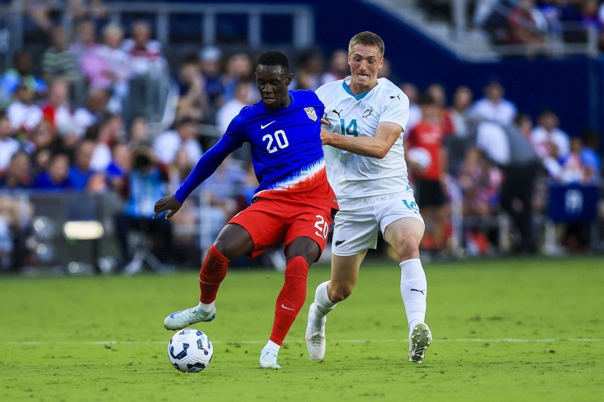 Sep 10, 2024; Cincinnati, Ohio, USA; USA forward Folarin Balogun (20) battles for the ball against New Zealand defender Finn Surman (14) in the first half at TQL Stadium. Mandatory Credit: Katie Stratman-Imagn Images
