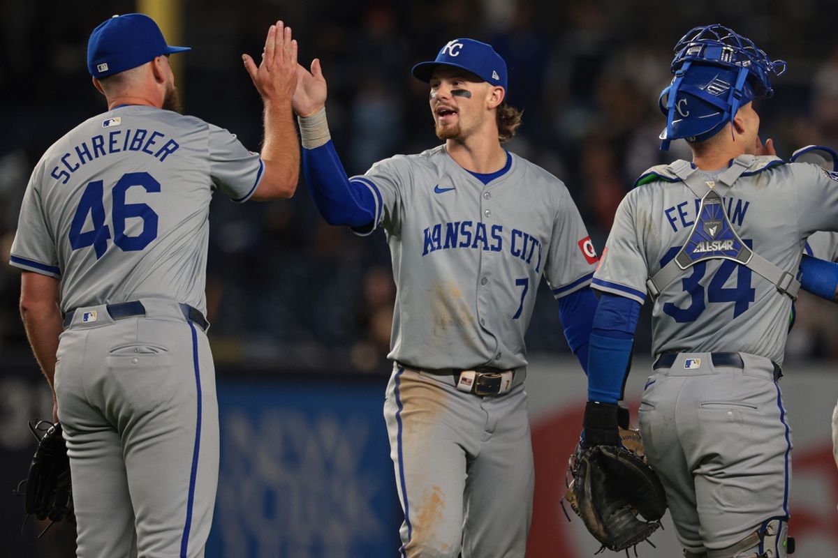 Sep 10, 2024; Bronx, New York, USA; Kansas City Royals shortstop Bobby Witt Jr. (7) and relief pitcher John Schreiber (46) celebrate after defeating the New York Yankees at Yankee Stadium. Mandatory Credit: Vincent Carchietta-Imagn Images