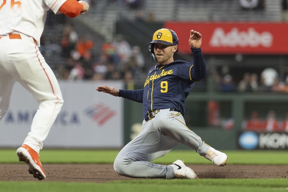 Sep 10, 2024; San Francisco, California, USA;  Milwaukee Brewers first base Jake Bauers (9) slides during the first inning against the San Francisco Giants at Oracle Park. Mandatory Credit: Stan Szeto-Imagn Images