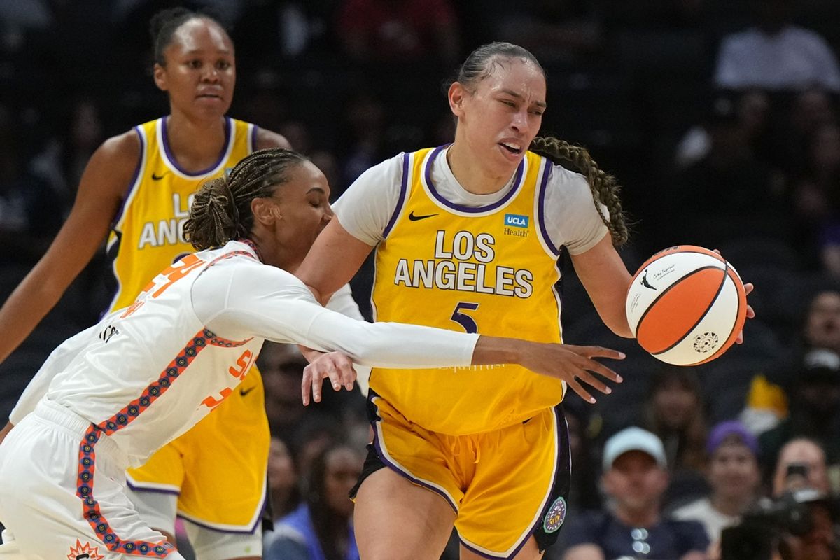 Sep 10, 2024; Los Angeles, California, USA; LA Sparks forward Dearica Hamby (5) is fouled by Connecticut Sun forward DeWanna Bonner (24) in the first half at Crypto.com Arena. Mandatory Credit: Kirby Lee-Imagn Images