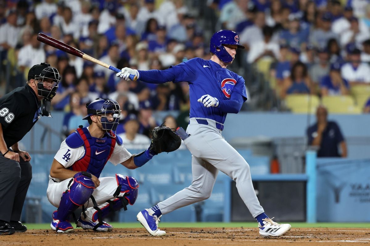 Sep 10, 2024; Los Angeles, California, USA;  Chicago Cubs center fielder Pete Crow-Armstrong (52) hits a RBI single during the second inning against the Los Angeles Dodgers at Dodger Stadium. Mandatory Credit: Kiyoshi Mio-Imagn Images