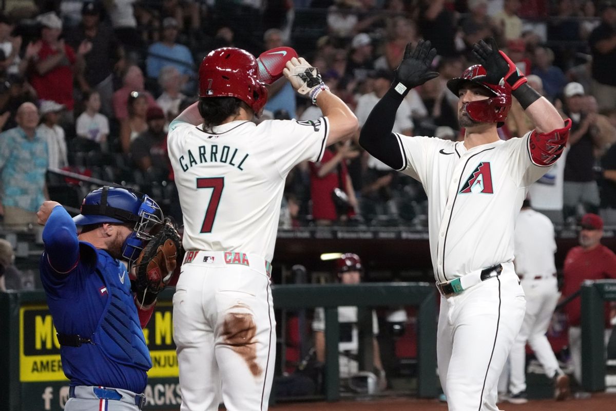Sep 11, 2024; Phoenix, Arizona, USA; Arizona Diamondbacks outfielder Randal Grichuk (15) celebrates with Corbin Carroll (7) after hitting a two-run home run and 200th of his career against the Texas Rangers in the first inning at Chase Field. Mandatory Credit: Rick Scuteri-Imagn Images