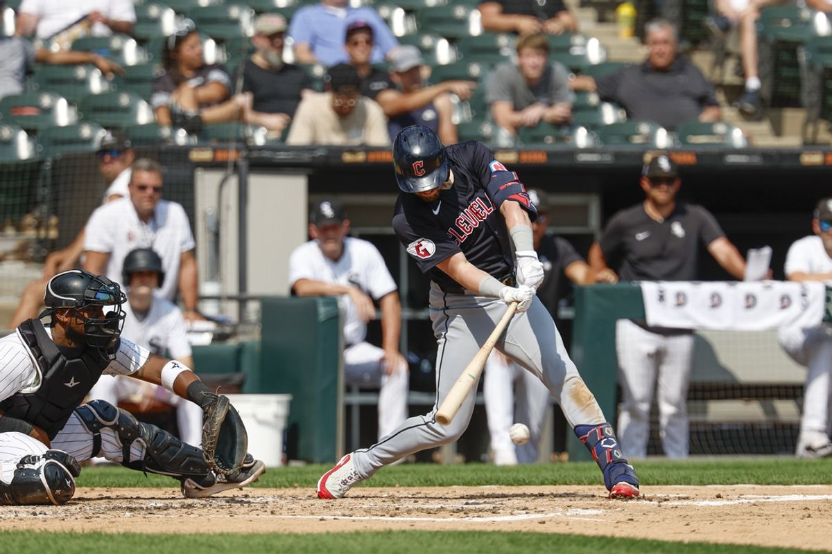 Sep 11, 2024; Chicago, Illinois, USA; Cleveland Guardians outfielder Lane Thomas (8) hits a two-run single against the Chicago White Sox during the third inning at Guaranteed Rate Field. Mandatory Credit: Kamil Krzaczynski-Imagn Images