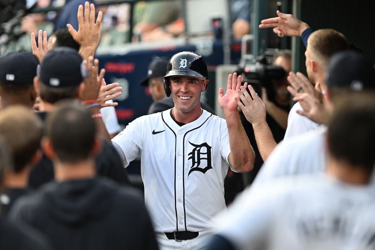 Sep 11, 2024; Detroit, Michigan, USA; Detroit Tigers designated hitter Kerry Carpenter (30) celebrates in the dugout after scoring a run  against the Colorado Rockies in the first inning at Comerica Park. Mandatory Credit: Lon Horwedel-Imagn Images