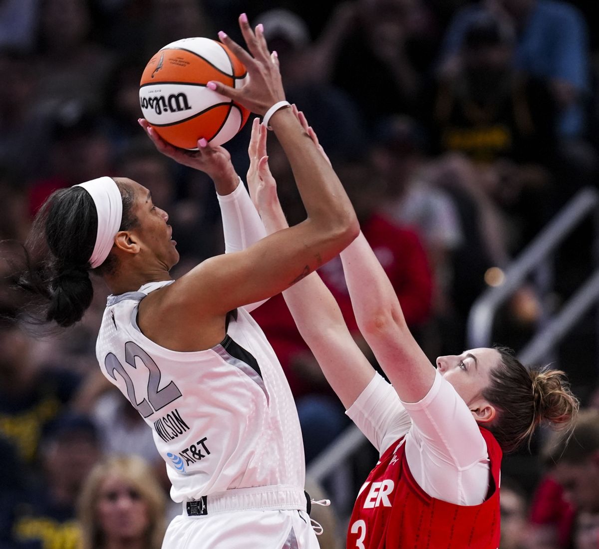 Sep 11, 2024; Indianapolis, Indiana, USA; Indiana Fever forward Katie Lou Samuelson (33) attempts to block Las Vegas Aces center A'ja Wilson (22) on Wednesday, Sept. 11, 2024, during a game between the Indiana Fever and the Las Vegas Aces at Gainbridge Fieldhouse in Indianapolis. The Aces defeated the Fever, 86-75. Mandatory Credit: Grace Smith