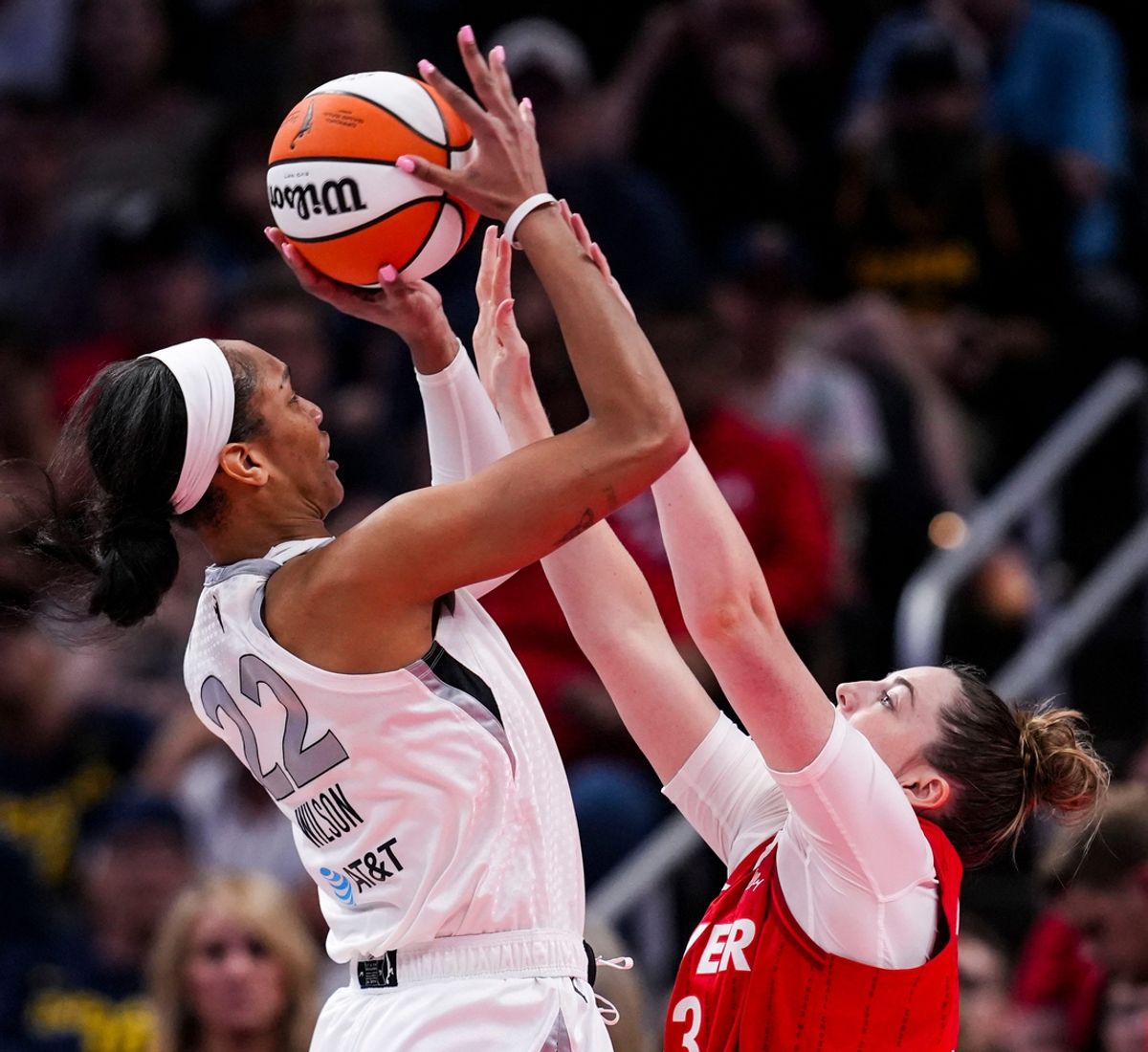 Indiana Fever forward Katie Lou Samuelson (33) attempts to block Las Vegas Aces center A'ja Wilson (22) on Wednesday, Sept. 11, 2024, during a game between the Indiana Fever and the Las Vegas Aces at Gainbridge Fieldhouse in Indianapolis. The Aces defeated the Fever, 86-75.