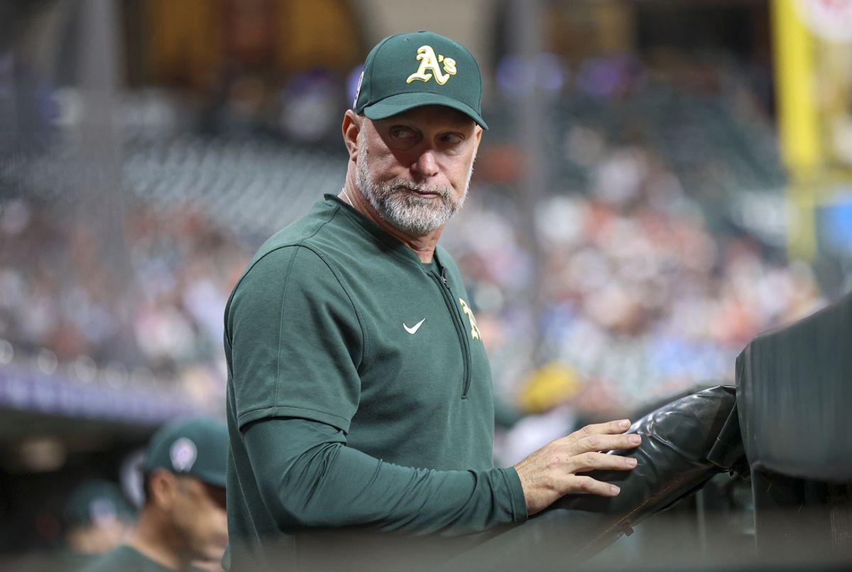 Sep 11, 2024; Houston, Texas, USA; Oakland Athletics manager Mark Kotsay (7) looks on from the dugout during the game against the Houston Astros at Minute Maid Park. Mandatory Credit: Troy Taormina-Imagn Images