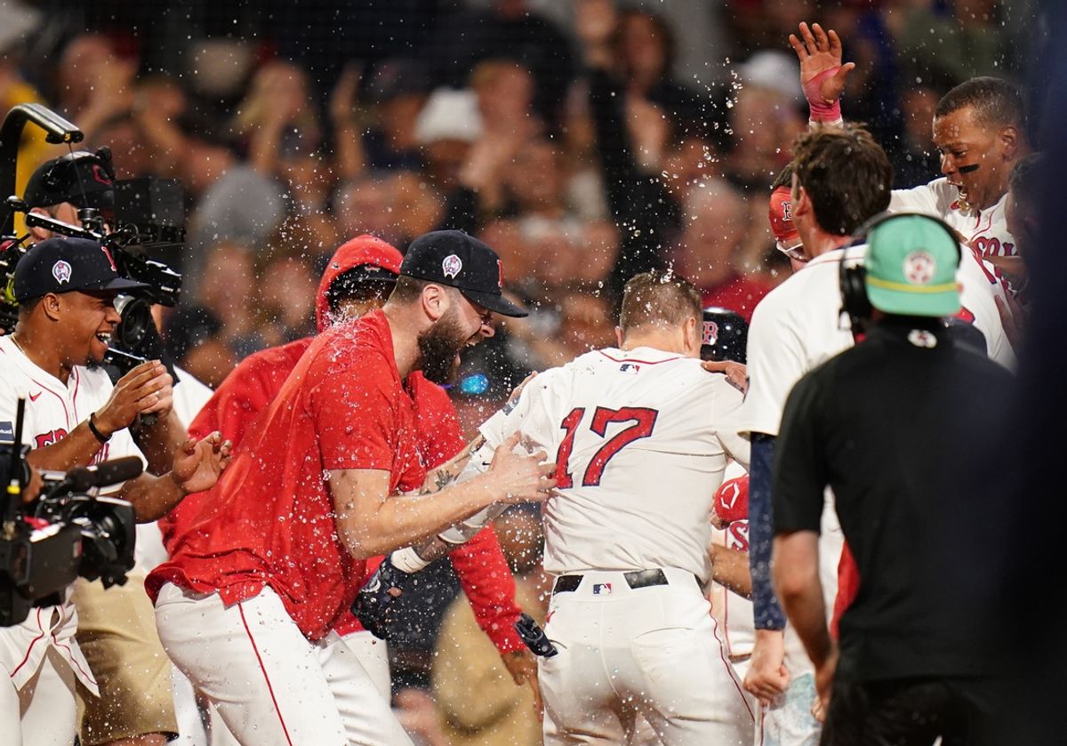 Sep 11, 2024; Boston, Massachusetts, USA; Boston Red Sox left fielder Tyler O'Neill (17) his a three run home run to win the game against the Baltimore Orioles in ten innings at Fenway Park. Mandatory Credit: David Butler II-Imagn Images