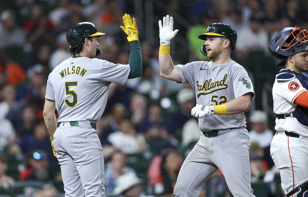 Sep 11, 2024; Houston, Texas, USA; Oakland Athletics catcher Kyle McCann (52) celebrates with shortstop Jacob Wilson (5) after hitting a home run during the sixth inning against the Houston Astros at Minute Maid Park. Mandatory Credit: Troy Taormina-Imagn Images