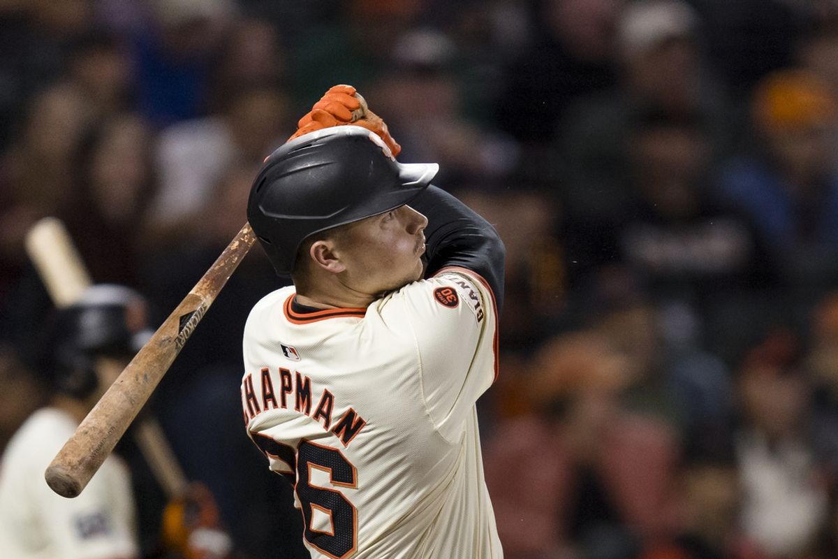 Sep 11, 2024; San Francisco, California, USA; San Francisco Giants third baseman Matt Chapman (26) hits a solo home run against the Milwaukee Brewers during the fourth inning at Oracle Park. Mandatory Credit: John Hefti-Imagn Images