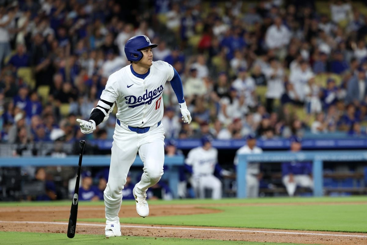 Sep 11, 2024; Los Angeles, California, USA;  Los Angeles Dodgers designated hitter Shohei Ohtani (17) hits a home run during the first inning against the Chicago Cubs at Dodger Stadium. Mandatory Credit: Kiyoshi Mio-Imagn Images