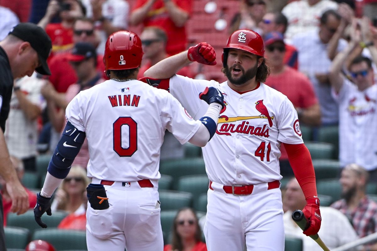 Sep 12, 2024; St. Louis, Missouri, USA;  St. Louis Cardinals shortstop Masyn Winn (0) celebrates with designated hitter Alec Burleson (41) after hitting a solo home run against the Cincinnati Reds during the third inning during the third inning at Busch Stadium. Mandatory Credit: Jeff Curry-Imagn Images